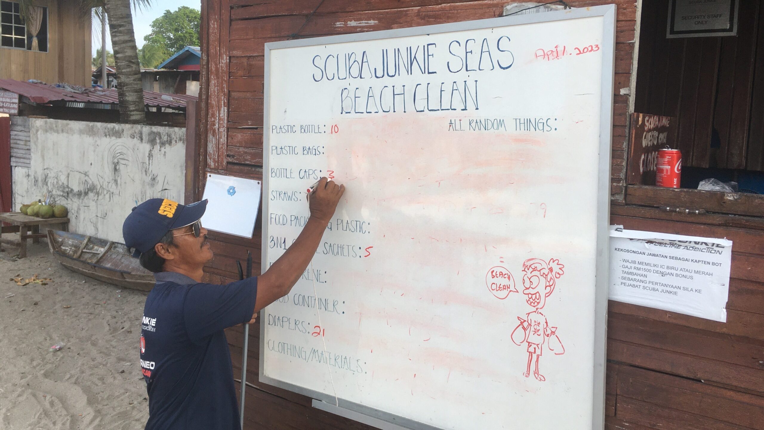 Security guard Ghanni helping caunting and categorizing the debris on the beach cleanups